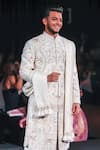 Jigar & Nikita_Ivory Silk Embroidery, Zari, Tassels The Kingdom Thread Siam Sherwani Set _Online_at_Aza_Fashions