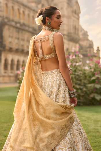 Seema Gujral_Ivory Silk, Net Embroidery, Sequins, Beads, Zari, Tassels, Bridal Lehenga Set _Online_at_Aza_Fashions