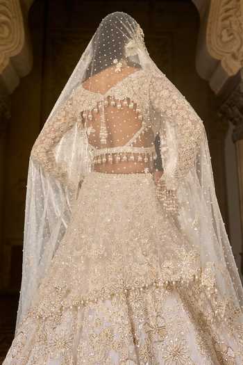 Seema Gujral_Ivory Net, Organza Sequins, Beads, Pearls, Tassels Work Bridal Lehenga Set _Online_at_Aza_Fashions