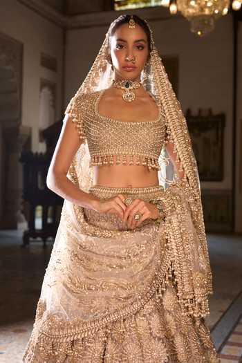 Shop_Seema Gujral_Gold Net Sequins, Beads, Pearls, Tassels Scoop Embroidered Bridal Lehenga Set _Online_at_Aza_Fashions