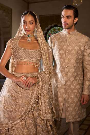 Shop_Seema Gujral_Gold Net Sequins, Beads, Pearls, Tassels Scoop Embroidered Bridal Lehenga Set _Online