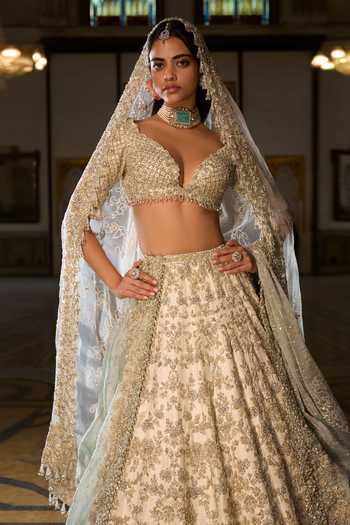 Seema Gujral_Ivory Silk, Organza Zari, Crystals, Tassels, Zardozi Work Bridal Lehenga Set _Online_at_Aza_Fashions
