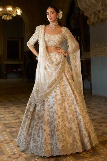Buy_Seema Gujral_Beige Net Sequins, Pearls, Zari, Crystals, Zardozi Work Bridal Lehenga Set _at_Aza_Fashions