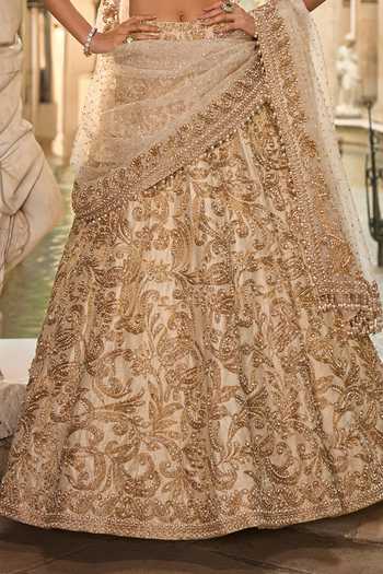 Shop_Seema Gujral_Beige Net Embroidery, Pearls, Sequins, Tassels Sweetheart Bridal Lehenga Set _Online_at_Aza_Fashions