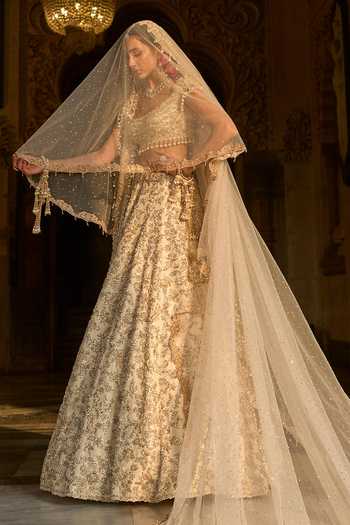 Seema Gujral_Ivory Net Sequins, Pearls, Zari, Crystals, Floral Embroidered Bridal Lehenga Set _Online_at_Aza_Fashions