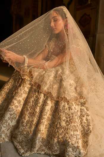 Shop_Seema Gujral_Ivory Net Sequins, Pearls, Zari, Crystals, Floral Embroidered Bridal Lehenga Set _Online_at_Aza_Fashions