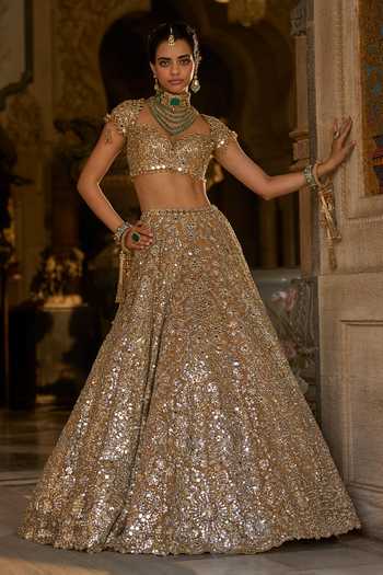 Seema Gujral_Gold Organza, Tissue Mirrors, Tassels Sweetheart Neck Work Bridal Lehenga Set _Online_at_Aza_Fashions