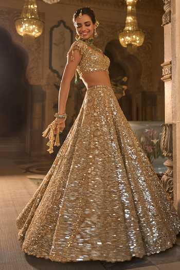 Shop_Seema Gujral_Gold Organza, Tissue Mirrors, Tassels Sweetheart Neck Work Bridal Lehenga Set _Online_at_Aza_Fashions