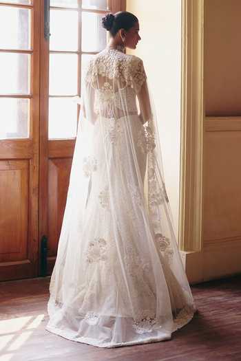 Shop_Mishru_Ivory Tulle Embroidery, Zarina Tonal Precious Flowers Corset And Skirt Set _at_Aza_Fashions