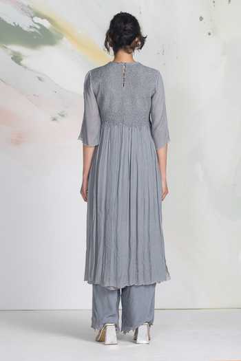 Shop_Ilk_Grey Chiffon, Mukaish Smocking Round Neck Starlight Side Slit Kurta _at_Aza_Fashions