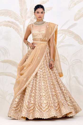 Buy_Shyam Narayan Prasad_Gold Silk, Organza, Tissue Gota Patti, Tassels Embroidered Lehenga Set _at_Aza_Fashions