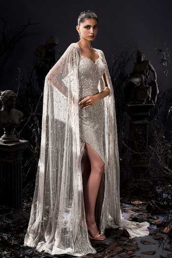 Buy_Shivani Awasty_Silver Net Sequins, Beads Sweetheart Neck Draped Sleeve Gown _Online_at_Aza_Fashions