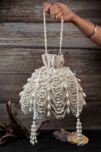 Nayaab By Sonia_Off White Pearls, Tassels Work Velvet Potli Bag _Online_at_Aza_Fashions