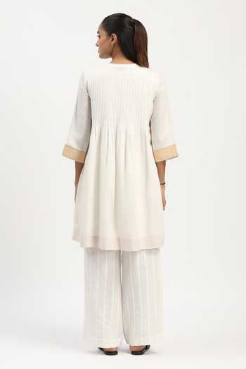 Shop_ABRAHAM AND THAKORE_Ivory Linen Round Neck Pleated Tunic _at_Aza_Fashions