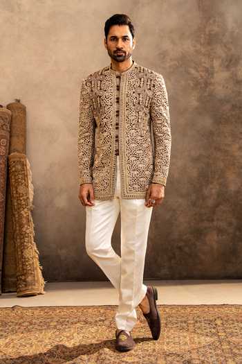Millionaire_Off White Georgette Embroidery Motif Bandhgala With Trouser _at_Aza_Fashions