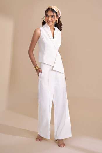 Shop_Naintara Bajaj_Ivory Lycra V-neck Asymmetric Structured Waistcoat _Online_at_Aza_Fashions