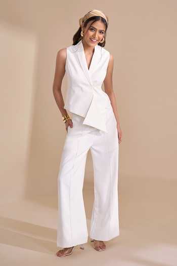 Naintara Bajaj_Ivory Lycra V-neck Asymmetric Structured Waistcoat _at_Aza_Fashions
