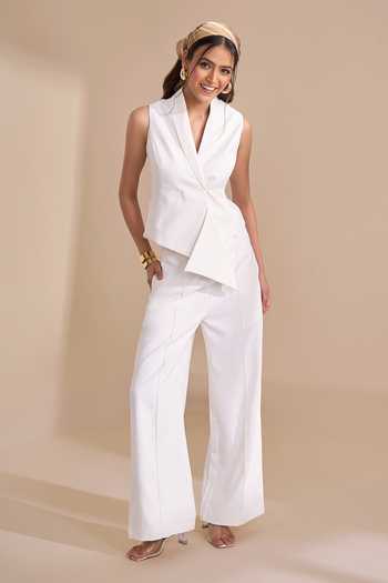 Naintara Bajaj_Ivory Lycra V-neck Structured Waistcoat And Trouser Set _at_Aza_Fashions