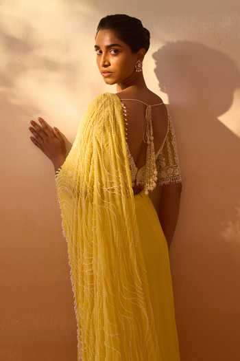 Nitika Gujral_Yellow Georgette, Net V-neck Pre-draped Saree With Blouse _at_Aza_Fashions