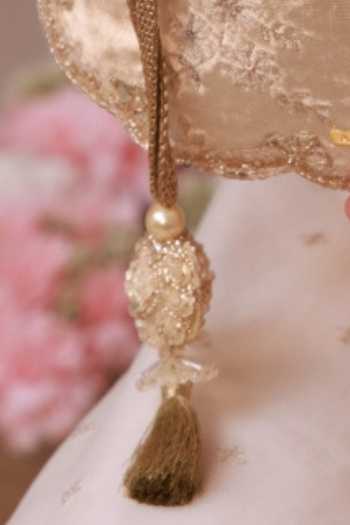 Amyra_Off White Embroidery, Beads, Pearls, Zari, Tassels Suki Velvet Scallop Potli _Online_at_Aza_Fashions
