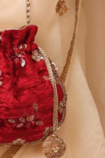 Buy_AMYRA_Red Embroidery, Sequins, Tassels Ras Velvet Scallop Potli _Online_at_Aza_Fashions