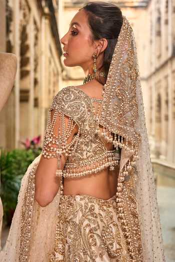 Seema Gujral_Beige Net Embroidery, Pearls, Sequins, Tassels Sweetheart Bridal Lehenga Set _Online_at_Aza_Fashions