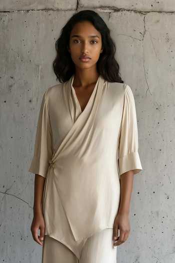 Buy_Vanshika Agarwal Label_Beige Satin V-neck Julia Wrap Top And Trouser Set _Online_at_Aza_Fashions