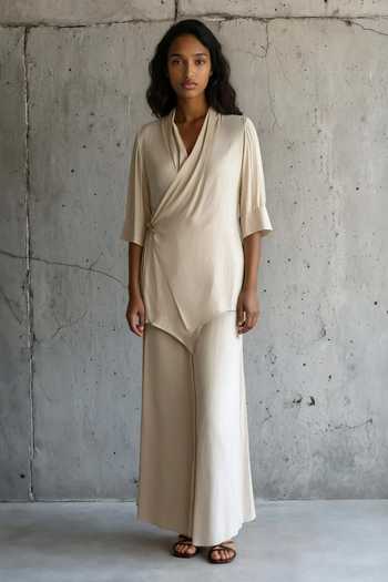 Shop_Vanshika Agarwal Label_Beige Satin V-neck Julia Wrap Top And Trouser Set _at_Aza_Fashions