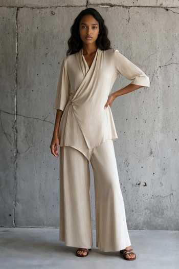 Buy_Vanshika Agarwal Label_Beige Satin V-neck Julia Wrap Top And Trouser Set _at_Aza_Fashions