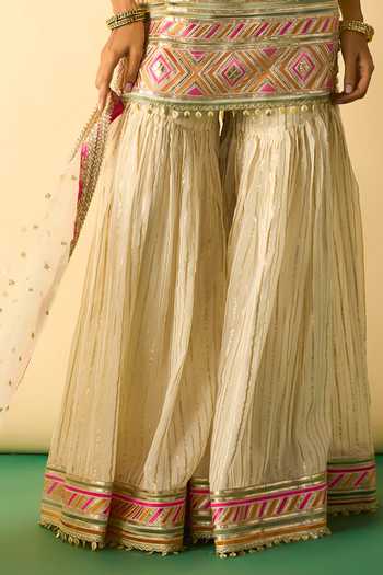 Buy_Gopi Vaid_Beige Organza, Viscose, Net Halter Neck Kriva Embroidered Tunic Sharara Set _Online_at_Aza_Fashions