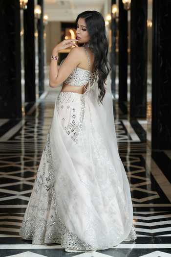 Archana Kochhar_Ivory Silk, Organza Sweetheart Neck Ainna Mirror Work Lehenga Set _Online_at_Aza_Fashions