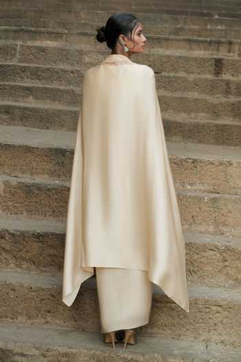 Shop_Eraaya by Ratika J_Beige Silk, Satin Shawl Neck Embroidered Cape Top With Skirt _at_Aza_Fashions