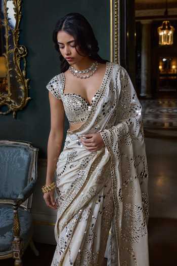 Seema Gujral_Beige Georgette, Silk Sweetheart Neck Mirror Work Saree With Blouse _Online_at_Aza_Fashions