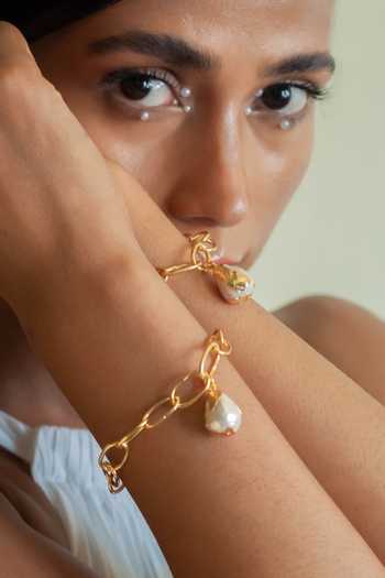 Buy_Dhwani Bansal Jewellery_Gold Plated Ona Baroque Pearl Embellished Bracelet _at_Aza_Fashions