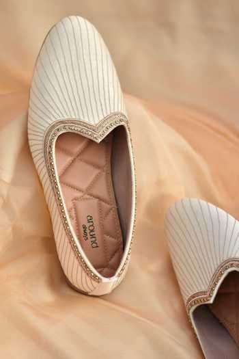 Shop_Around Always_Ivory Shaurya Stitched Juttis _Online_at_Aza_Fashions