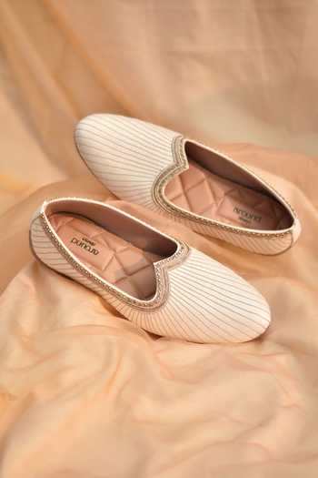Shop_Around Always_Ivory Shaurya Stitched Juttis _at_Aza_Fashions