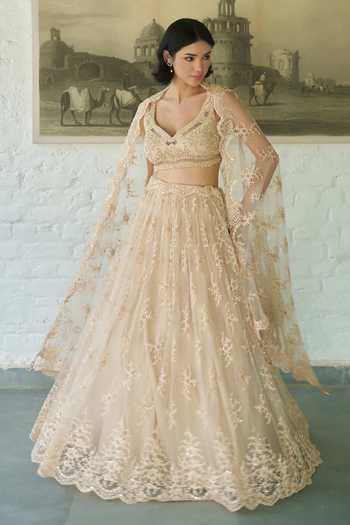 Shop_Meenagurnam_Ivory Net V-neck Embellished Lehenga Set _at_Aza_Fashions