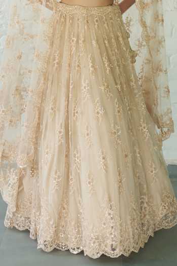 Shop_Meenagurnam_Ivory Net V-neck Embellished Lehenga Set _Online_at_Aza_Fashions