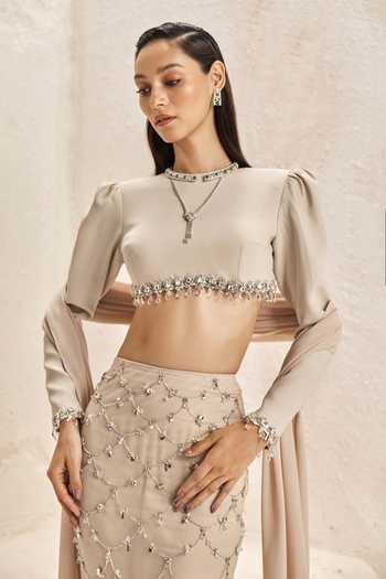 Shop_Nirmooha_Ivory Satin, Net, Bemberg, Microfiber Crescent Embellished Crop Top Skirt Set _Online_at_Aza_Fashions