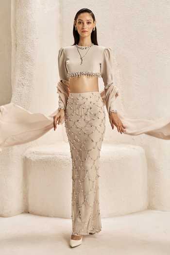 Shop_Nirmooha_Ivory Satin, Net, Bemberg, Microfiber Crescent Embellished Crop Top Skirt Set _at_Aza_Fashions