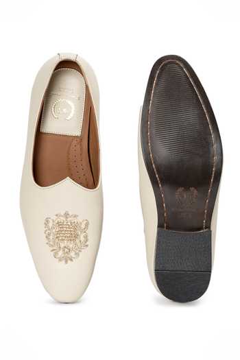 Shop_Domani_Cream Noor Crest Leather Slip On Loafers _Online_at_Aza_Fashions