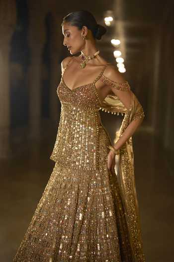 Buy_Seema Gujral_Gold Net Sweetheart Neck Stone Embellished Lehenga Set _Online_at_Aza_Fashions
