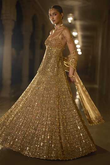 Shop_Seema Gujral_Gold Net Sweetheart Neck Stone Embellished Lehenga Set _Online_at_Aza_Fashions