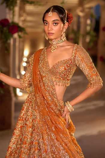 Seema Gujral_Orange Silk, Organza Sweetheart Neck Rust Zardozi Bridal Lehenga Set _at_Aza_Fashions