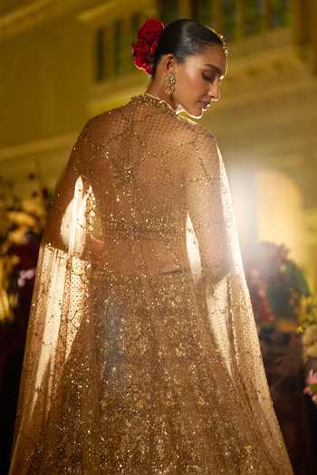 Shop_Seema Gujral_Gold Net Halter Neck Sequin Embroidered Bridal Lehenga Set _at_Aza_Fashions