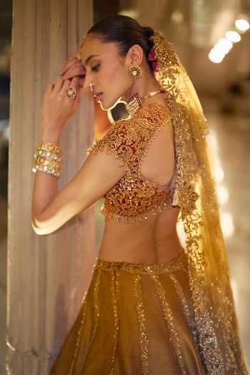 Shop_Seema Gujral_Gold Velvet, Silk, Net Sweetheart Neck Paisley Embroidered Lehenga Set _Online_at_Aza_Fashions