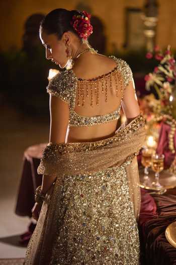 Shop_Seema Gujral_Gold Net Sweetheart Neck Jeweled Embroidered Lehenga Set _at_Aza_Fashions