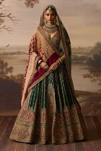 Buy_ANGAD SINGH_Emerald Green Silk V-neck Raavi Raw Bridal Lehenga Set _at_Aza_Fashions