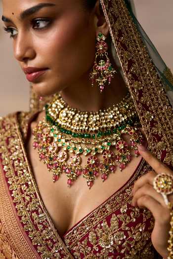 Buy_ANGAD SINGH_Emerald Green Silk V-neck Raavi Raw Bridal Lehenga Set 