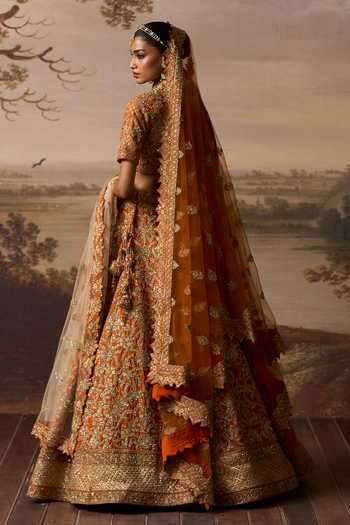 Shop_ANGAD SINGH_Orange Silk Sweetheart Neck Kesar Raw Bridal Lehenga Set _at_Aza_Fashions